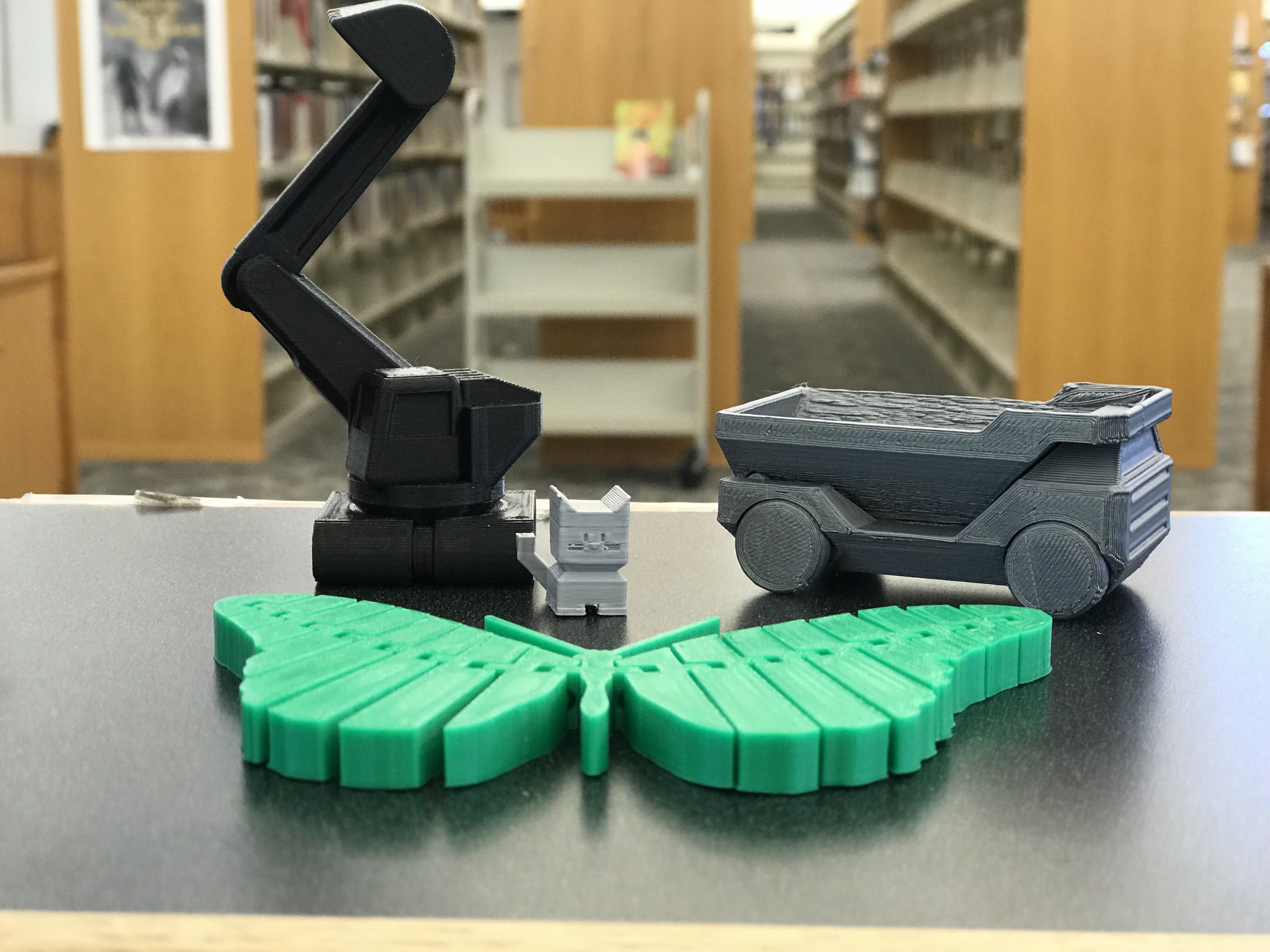 sample 3d printed objects on the reference desk