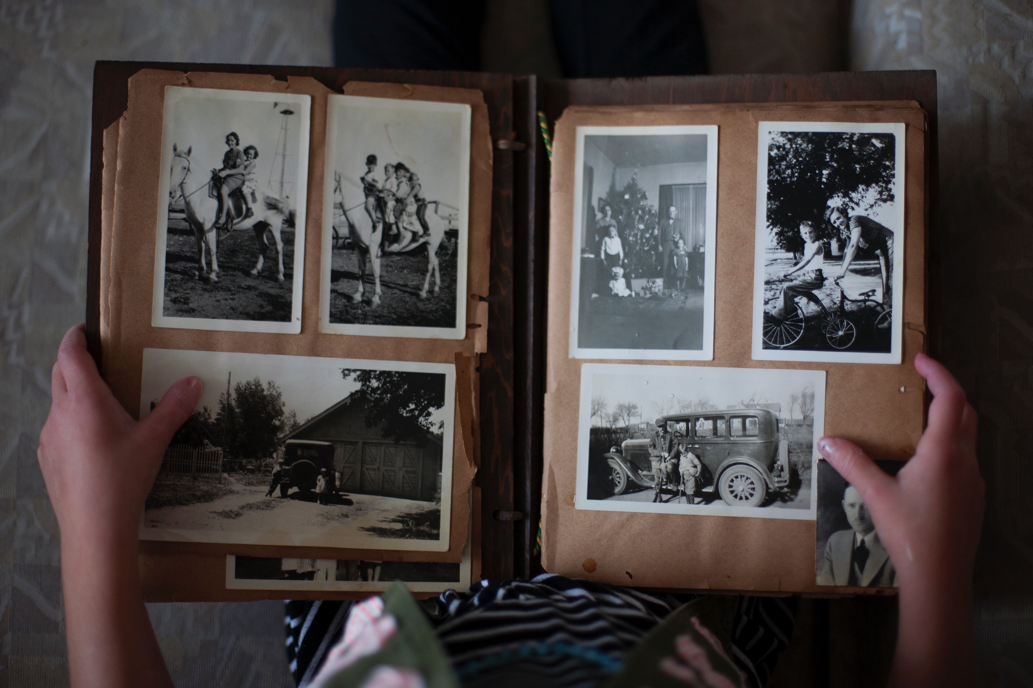Person looking at old photo album