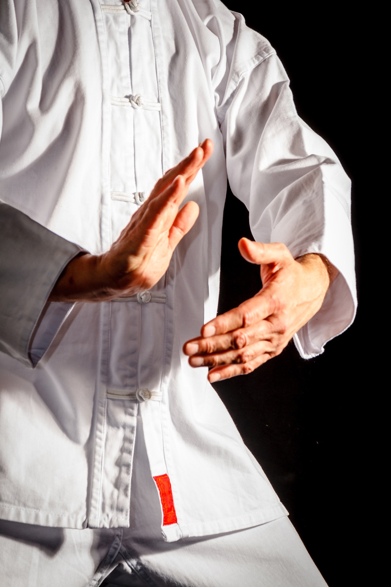 close up on person doing tai chi movements