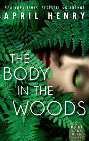 book cover of the body in the woods with ferns and woman's face