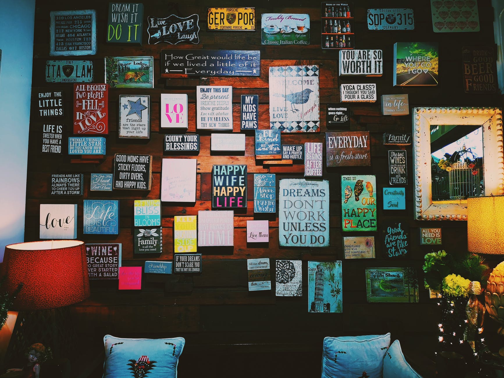 A wall filled with motivational signs