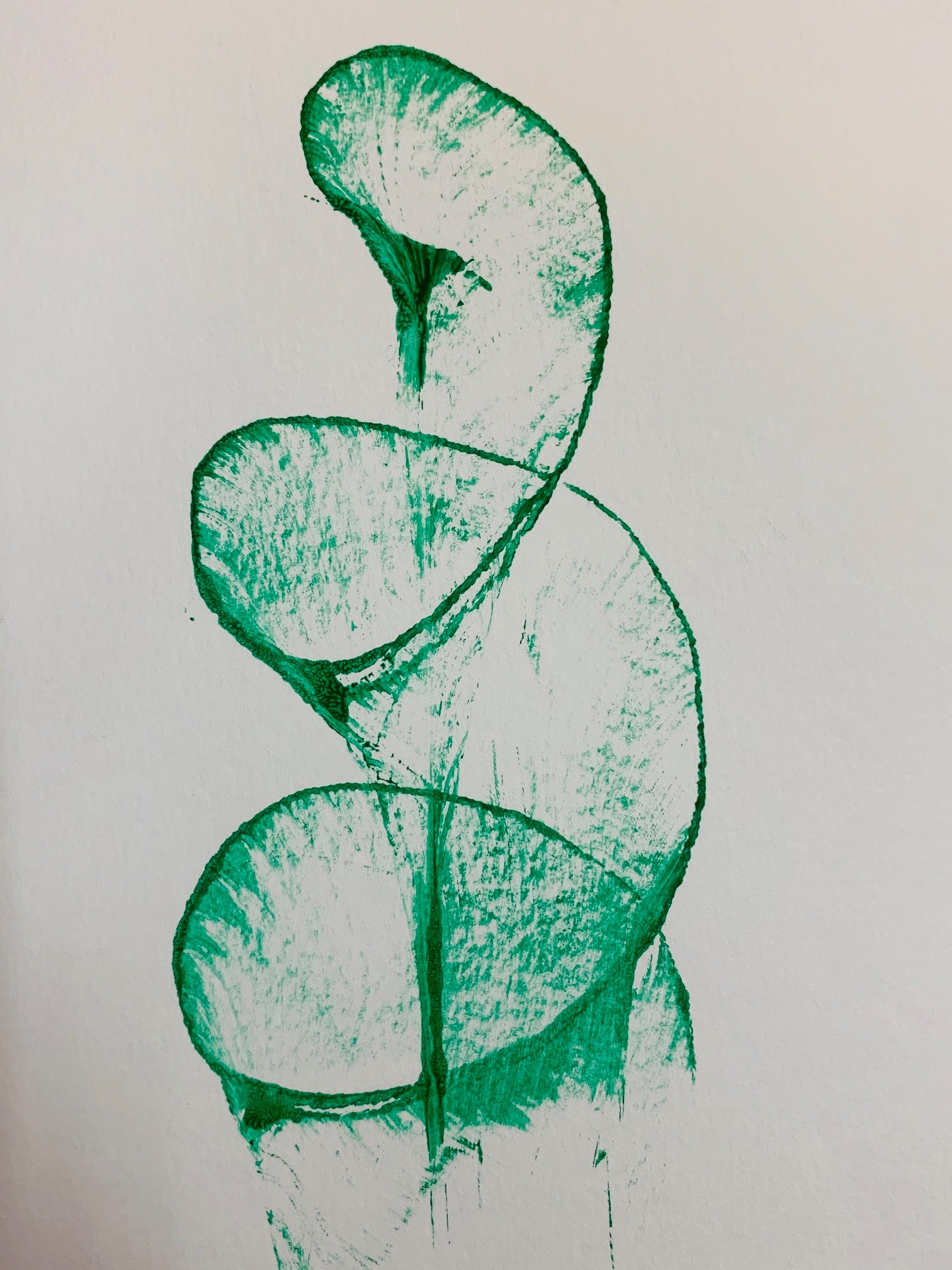 green spiral on white paper