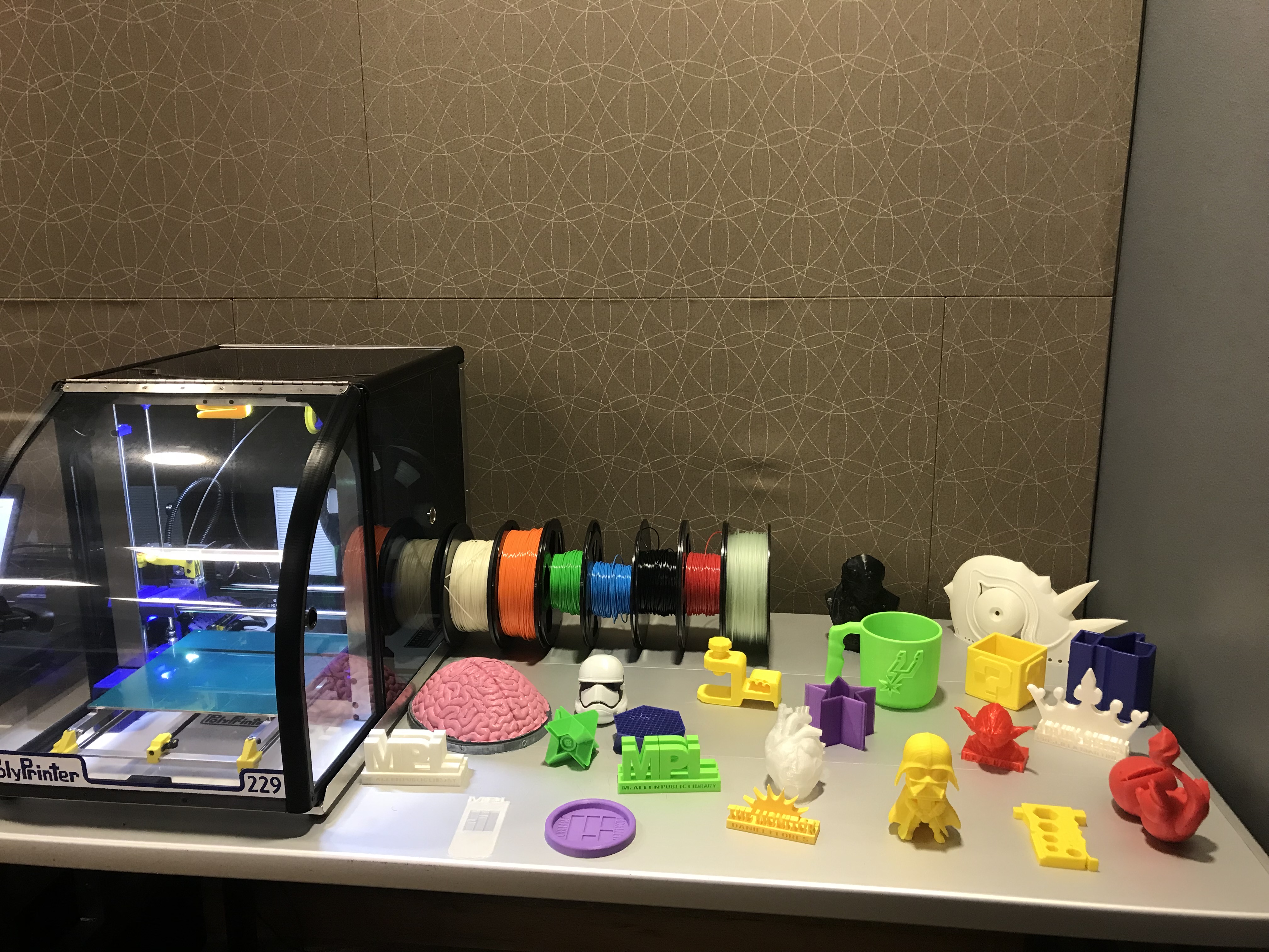 Image of 3D printer with objects that have been printed