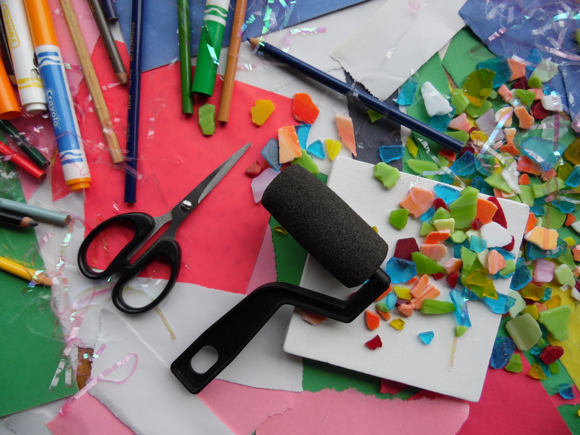 Art and craft supplies laid out on a table.