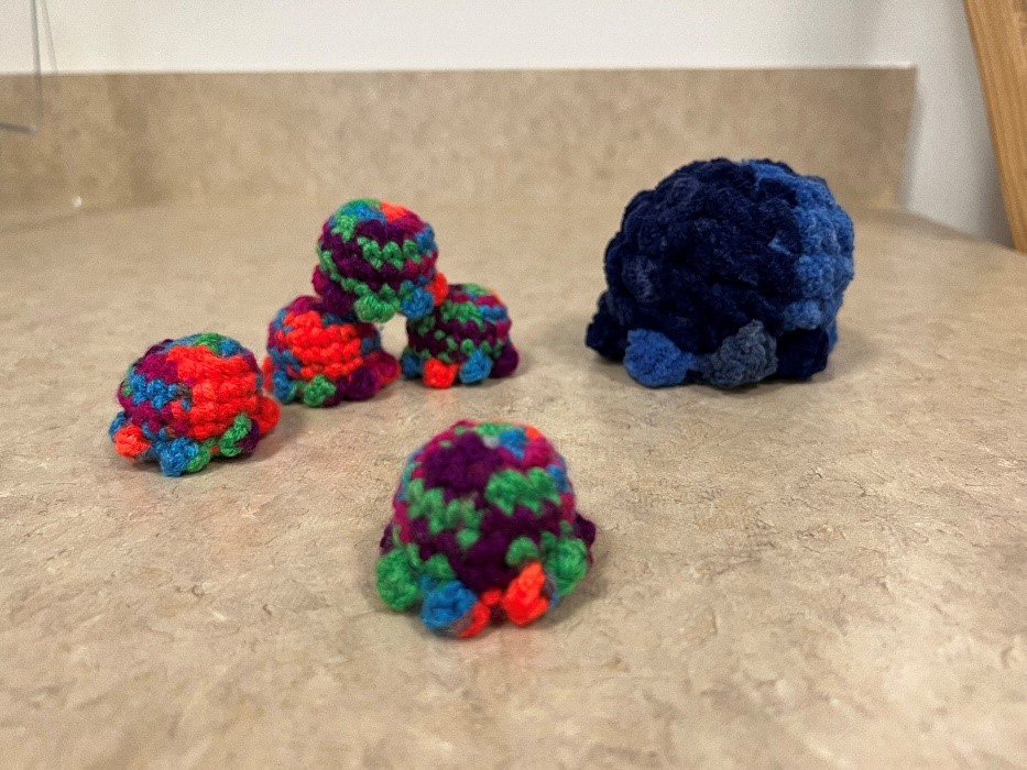 Small crocheted amigurumi octopus toys.
