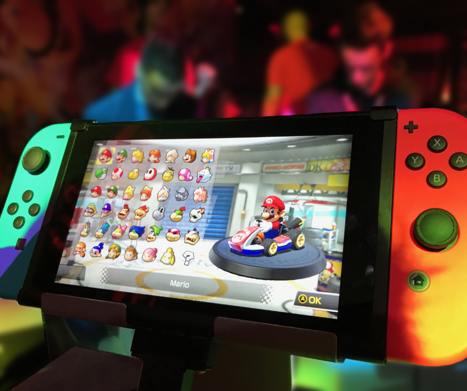 Close-up of a Nintendo Switch with a Mario Kart video game on the screen