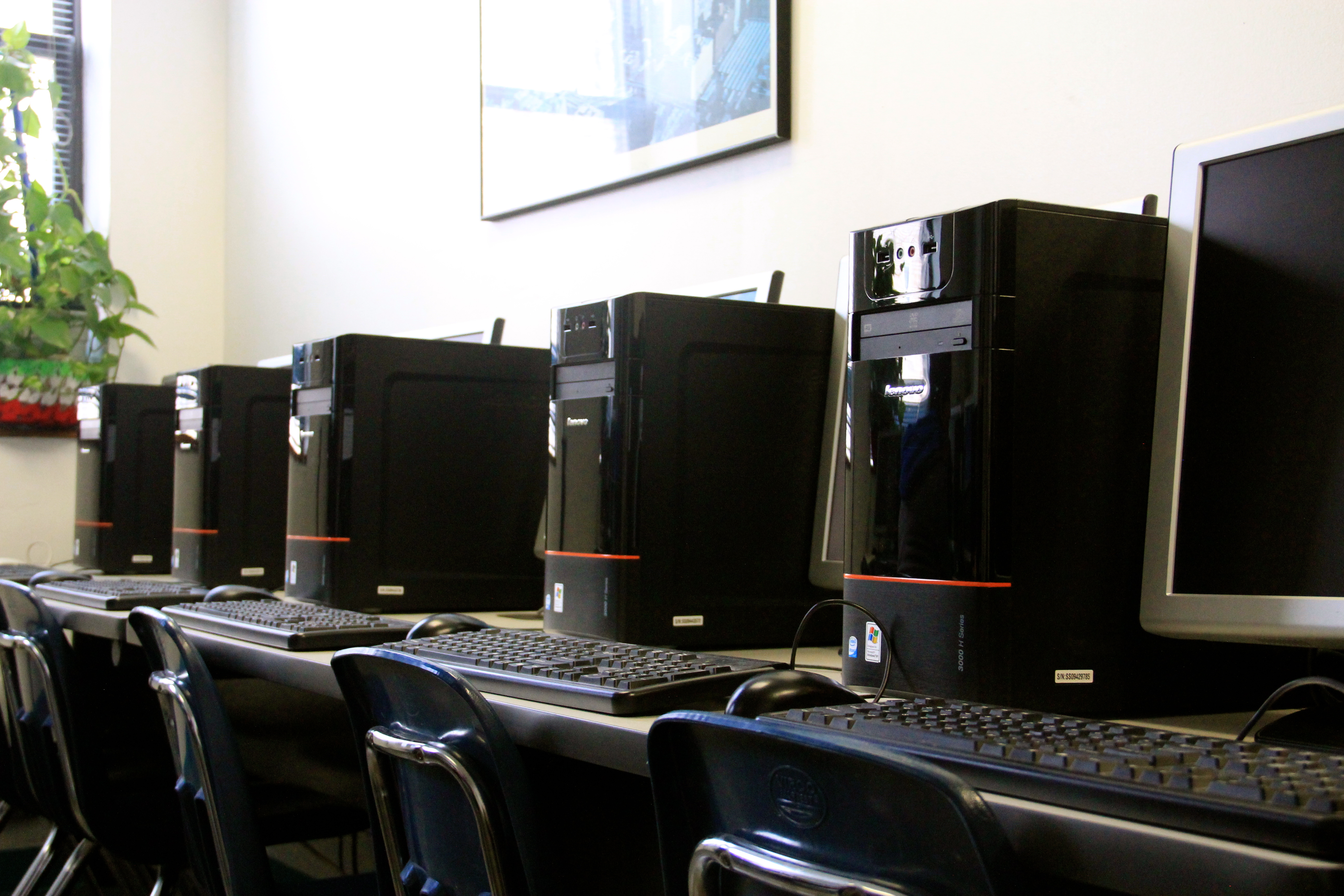 A row of computers on a table