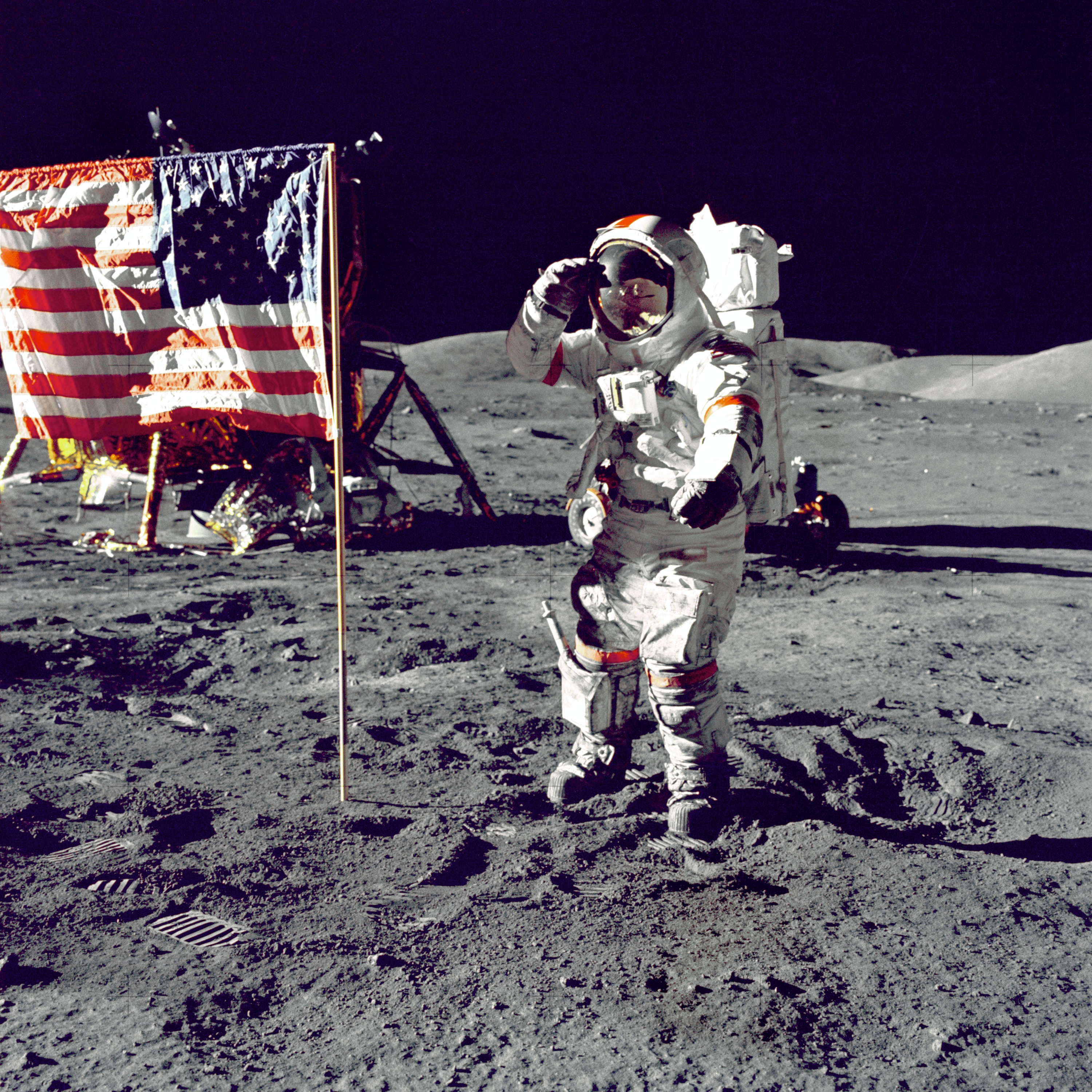 Astronaut saluting US flag on moon