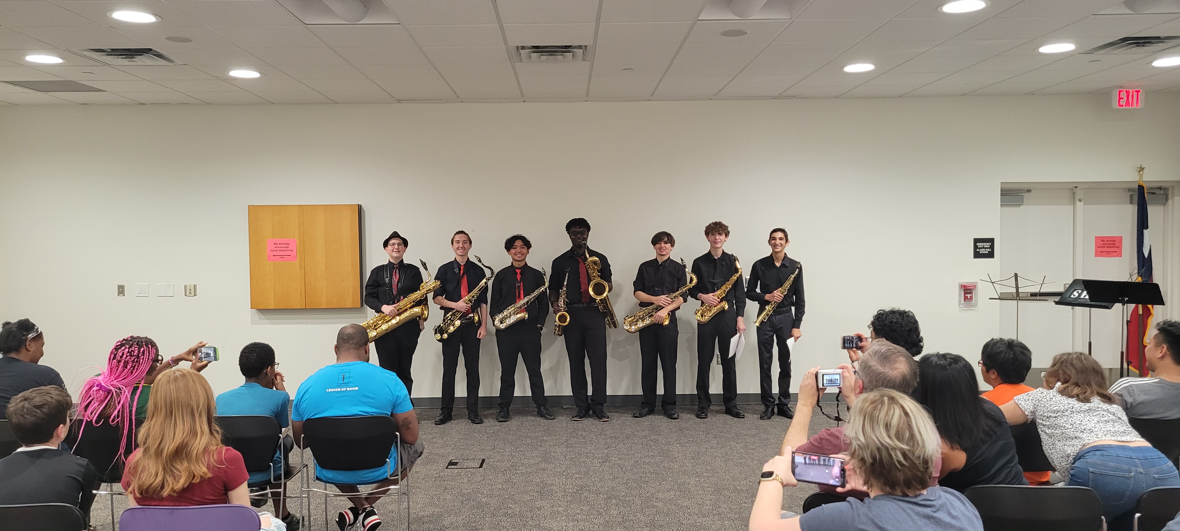 A saxophone quartet performing in the Meeting Room at Sienna Branch Library