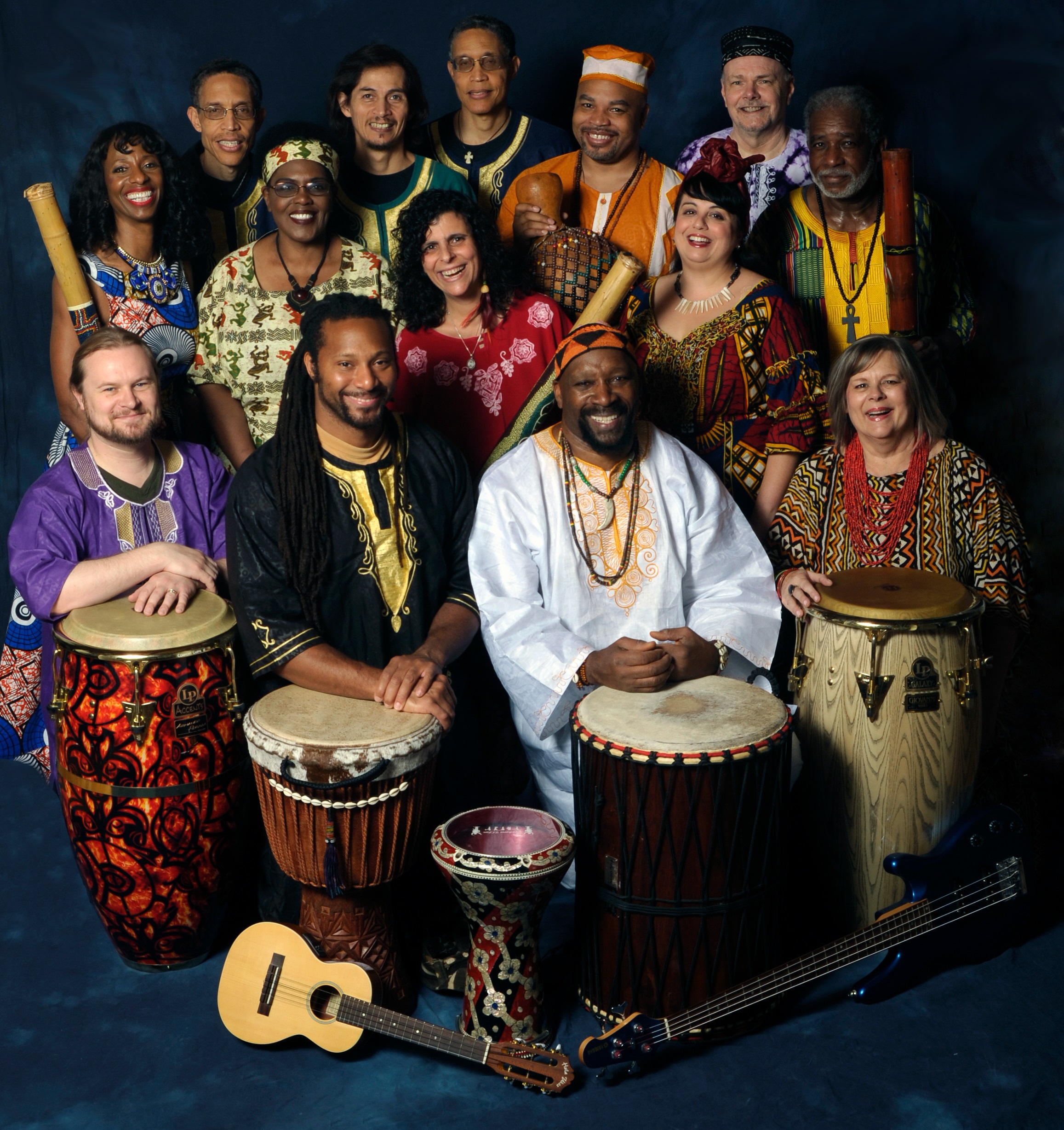 A photo of the members of the Joy of Djembe Drumming Ensemble, with their instruments.