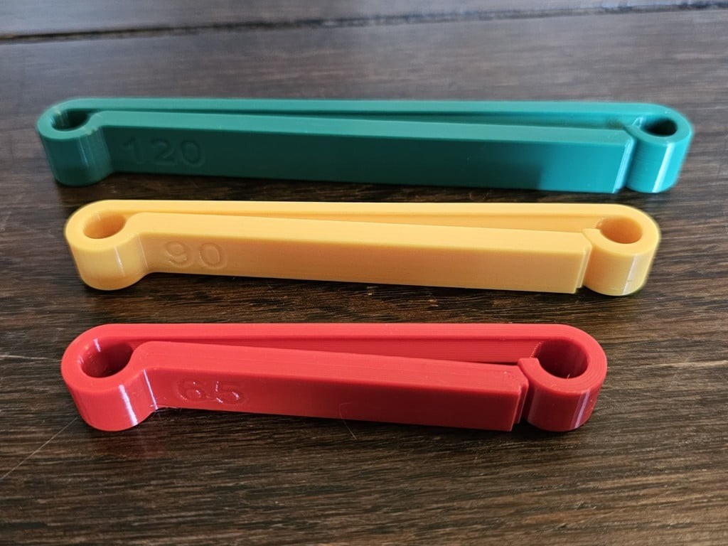 close up of 3D printed bag clips in green, yellow, and red