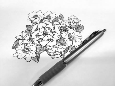 Flowers drawn in black ink on white paper with a black pen. 