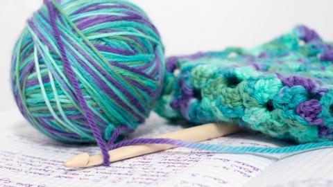 Image of a ball of yarn and a crochet pattern
