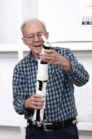 F. Don Cooper holds a model rocket